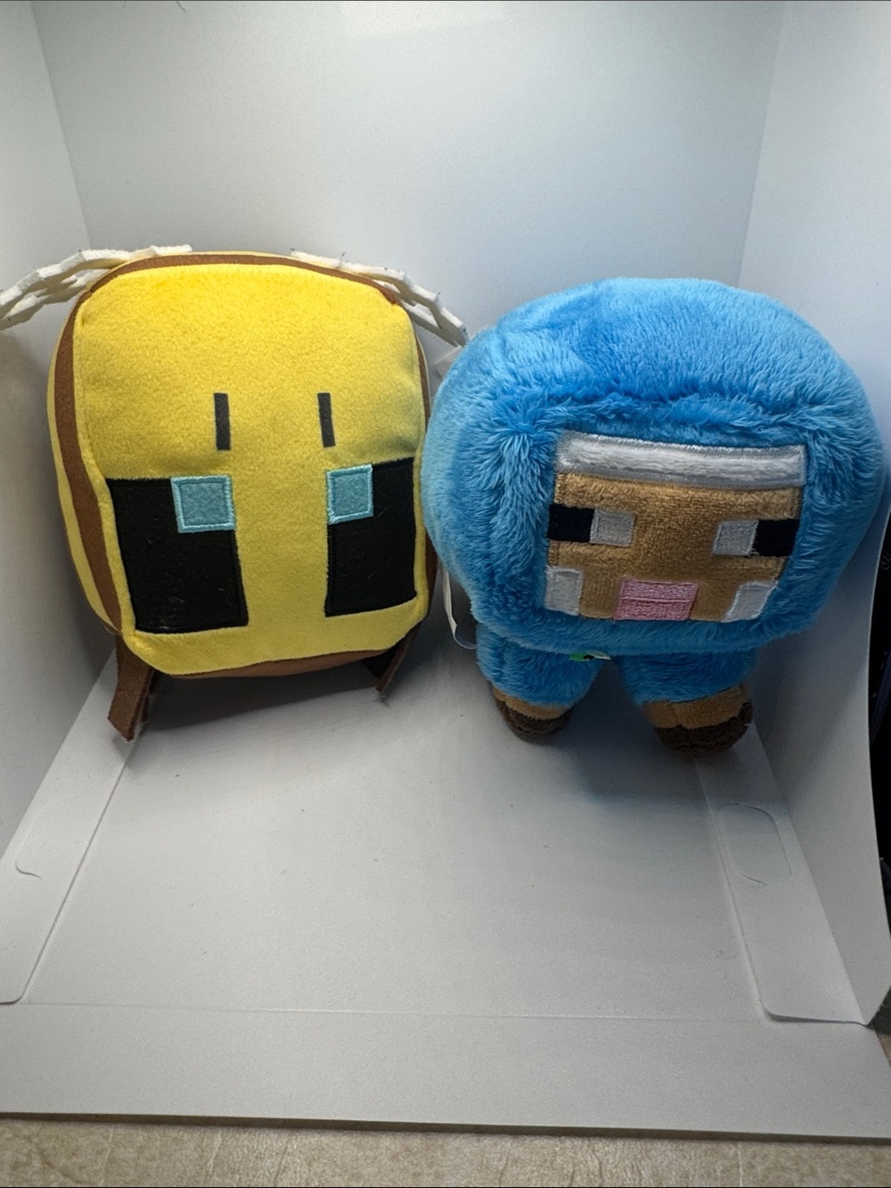 Minecraft plushies yellow and blue